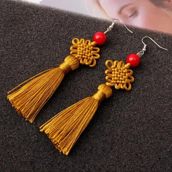 Design de boucle d'oreille en soie, motif noeud