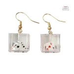Accessoire tendance : boucle d'oreille inspirée du poker