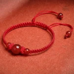 Bracelet tressé avec perles d'agate rouge