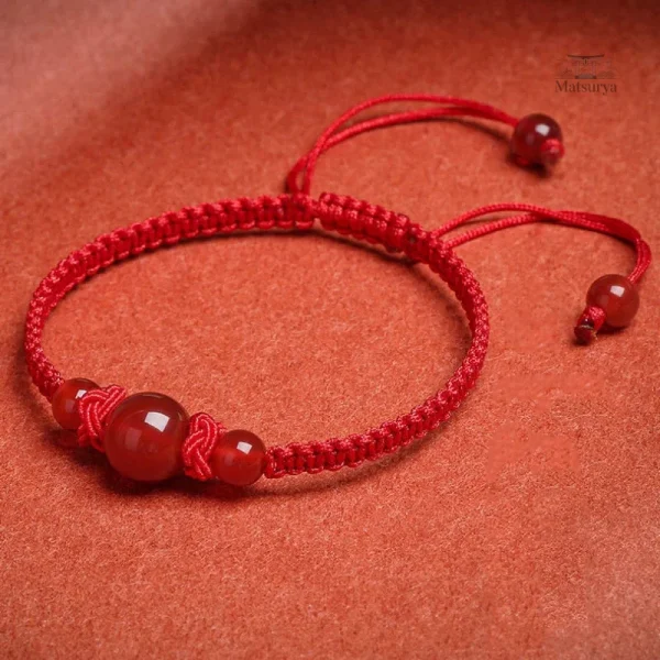 Bracelet tressé avec perles d'agate rouge