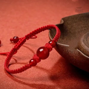 Bijou en perles d'agate rouge tressées