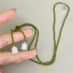 Accessoire en perles de cristal inspiré du muguet