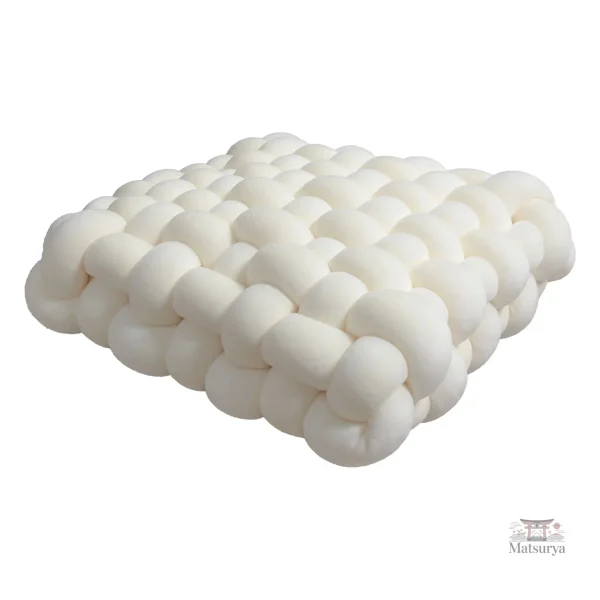Coussin douillet en version tressée pour salon