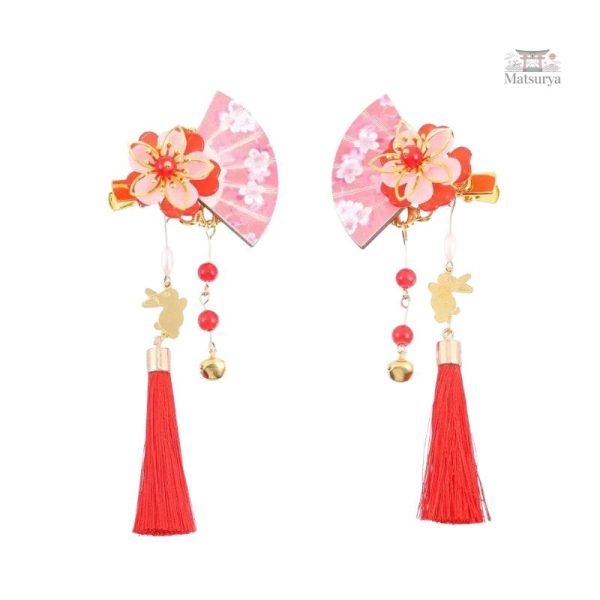 Accessoire capillaire traditionnel avec pompon