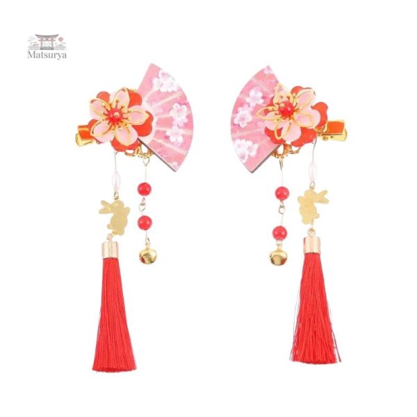 Épingle à cheveux longue avec décor pompon