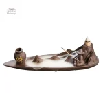 Fontaine à encens avec motif de pêcheur zen