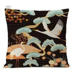 Housse de coussin noire avec motifs de grues japonaises