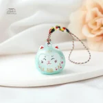 Accessoire porte-clés en forme de chat chanceux