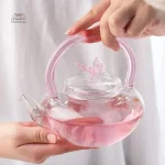 Théière en verre transparent, teinte rose douce